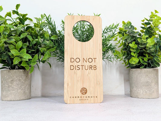 5mm bamboo door hanger reverse side engraved Refresh and Renew, on concrete surface