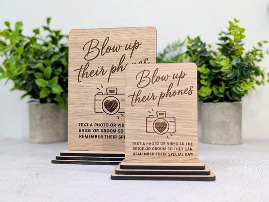Oak wedding sign asking guests to text photos and videos to the bride and groom