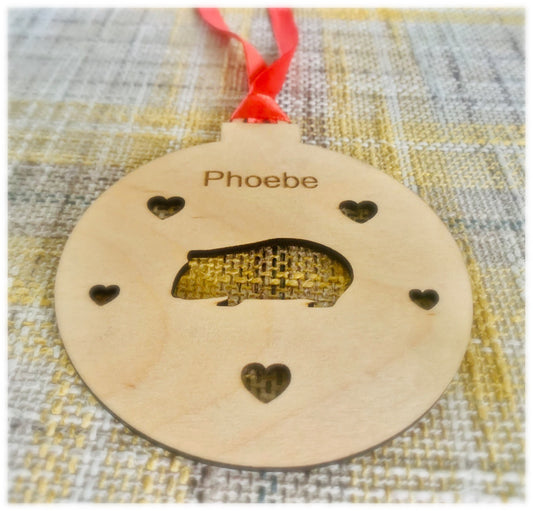 Guinea pig bauble close-up showing personalised name and hearts engraved on birch