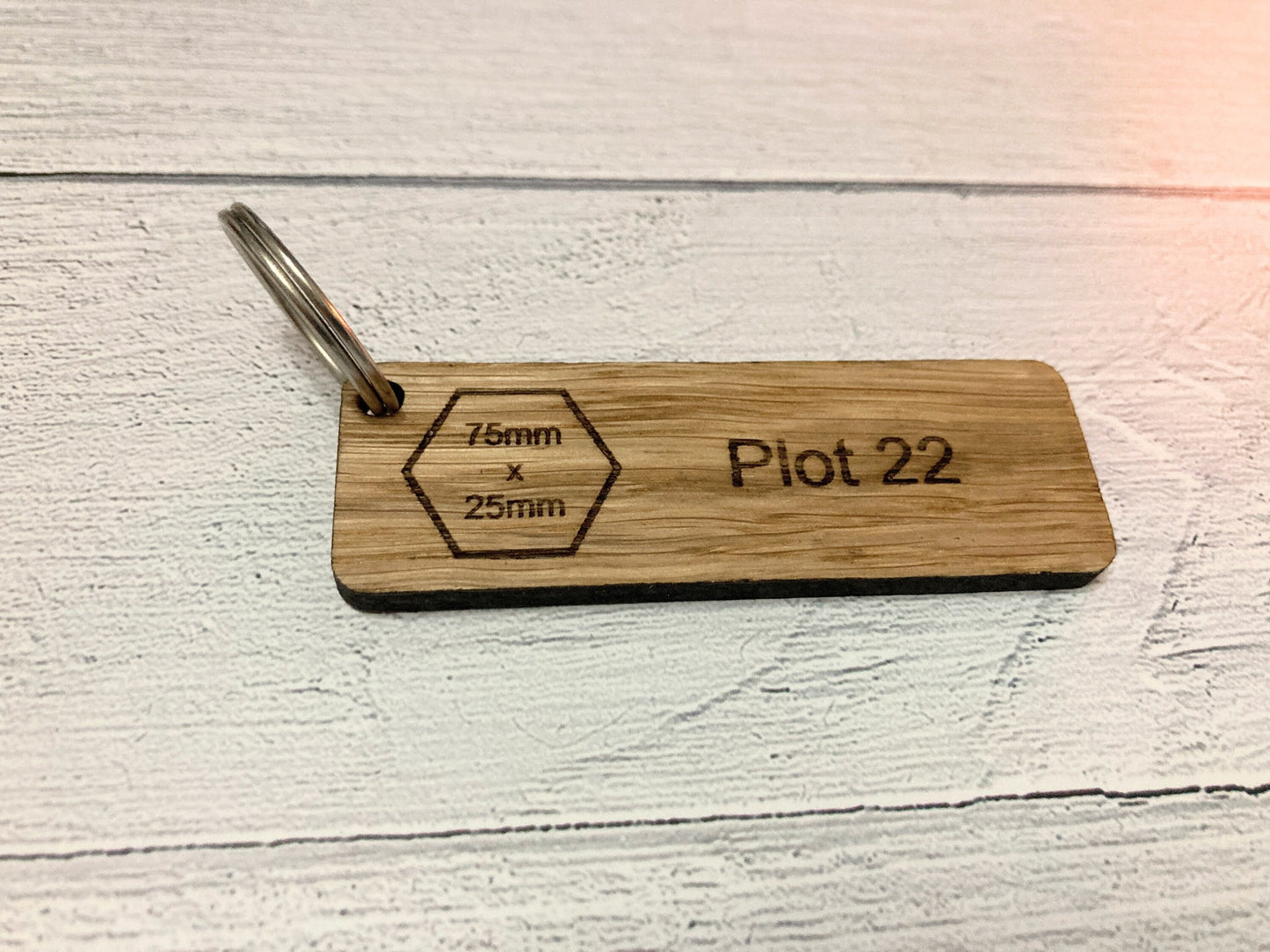 Personalised oak keyrings in 7 sizes — logo or text engraved to order, made in Wales