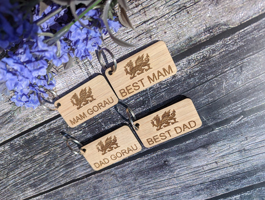 Welsh Dragon keyring close-up showing Best Dad and Welsh Dragon engraved on oak