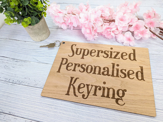 Supersized A4 oak keyring close-up of engraved text, 297x210mm