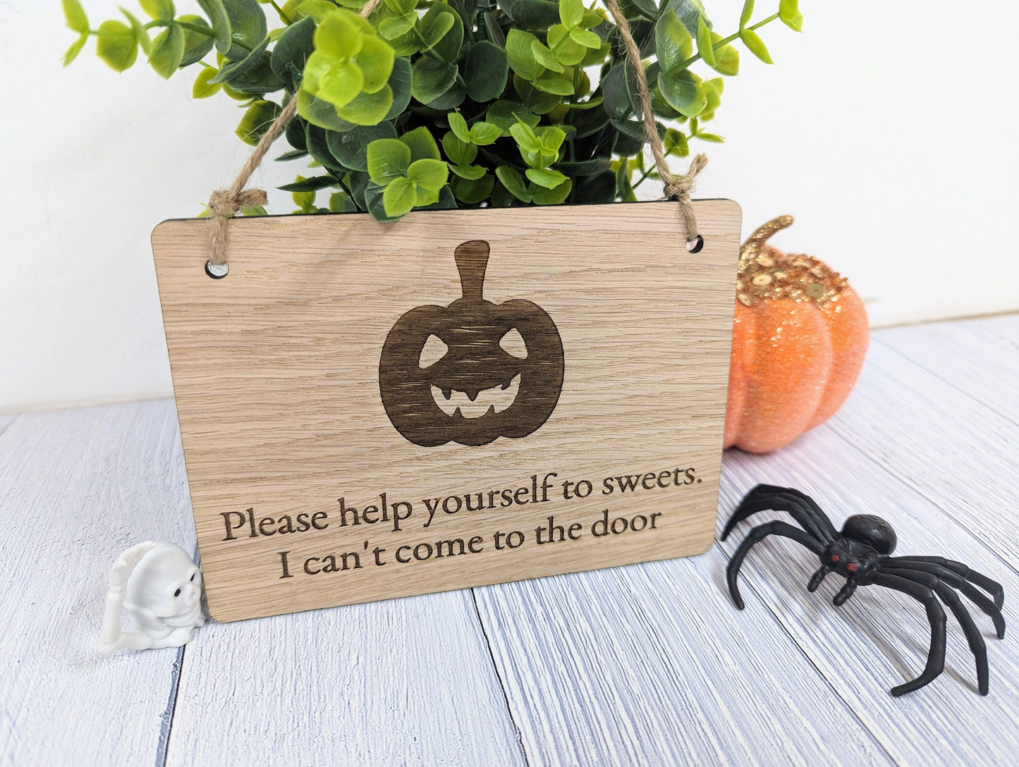 Four sizes of Halloween pumpkin oak sign displayed together