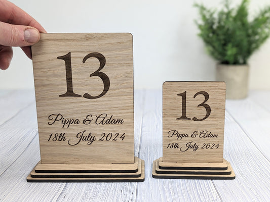 Wedding table number sign showing engraved names and date — standard 74x112mm size