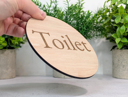 Toilet Door Sign – Circular Oak Veneered Wooden Bathroom Sign, Indoor Use Only, Handmade in Wales, Plastic-Free Packaging, 2 Sizes