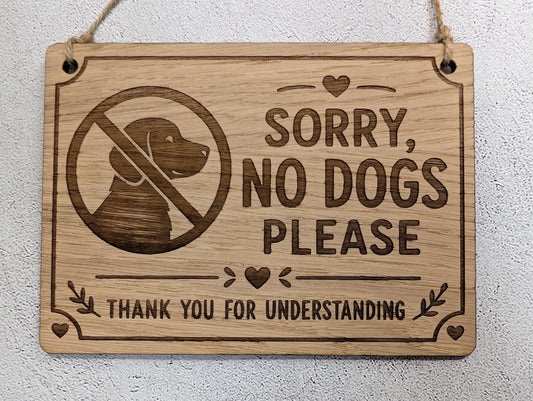 Sorry No Dogs Please wooden sign hung on natural jute twine
