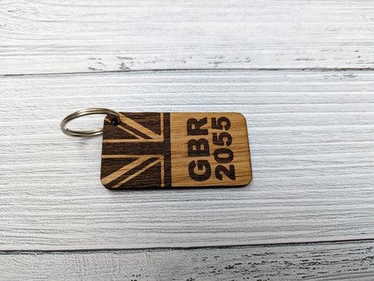 Sail number keyring close-up showing GBR 181 engraved on oak veneered MDF