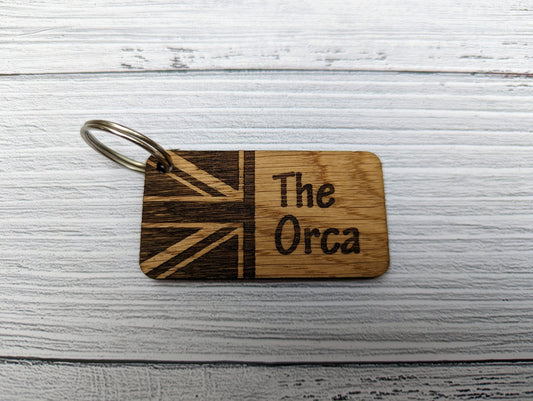 Sailing boat name keyring close-up showing personalised name engraved on oak veneered MDF
