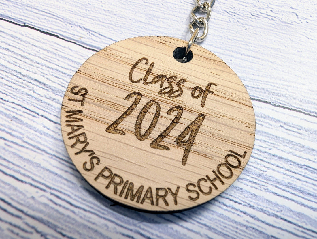 Class Of keyrings for school leavers showing multiple names on round oak keyrings