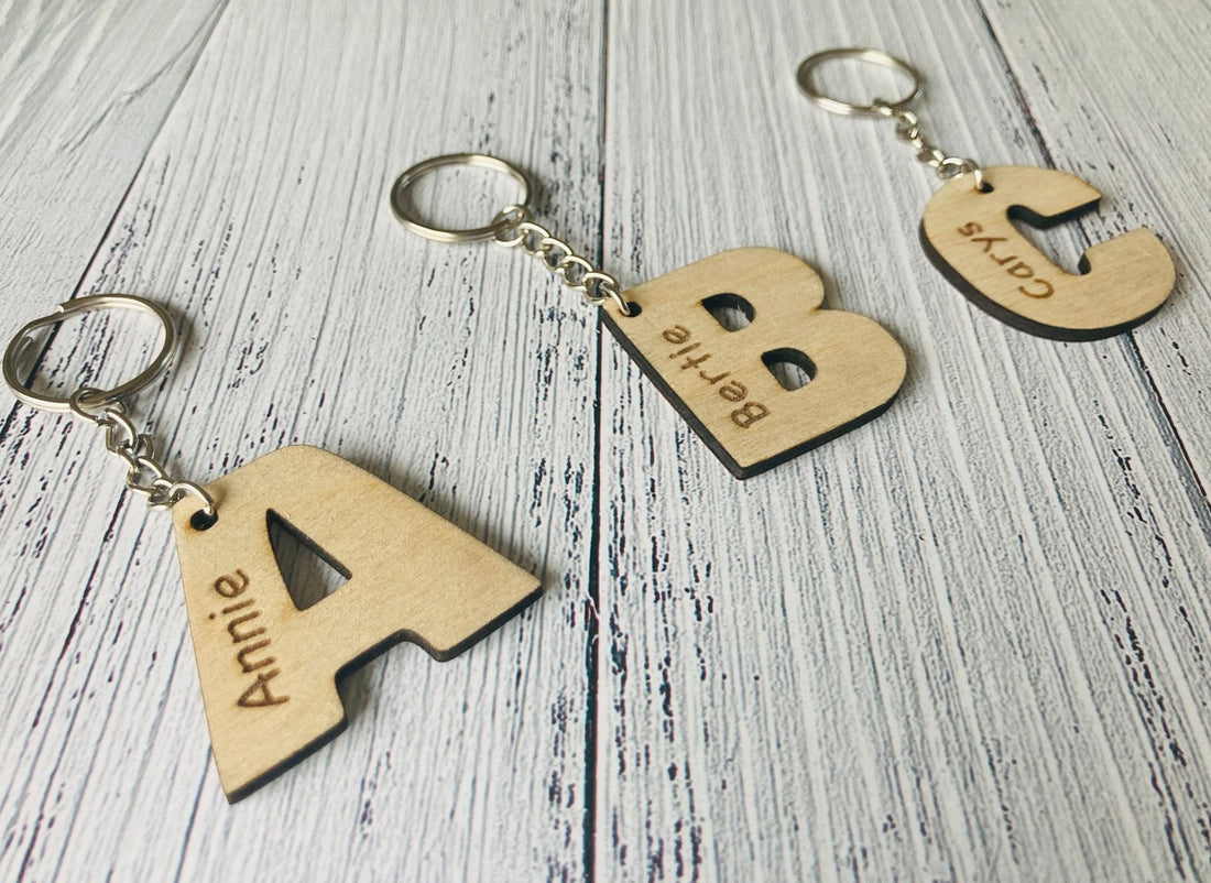 Personalised oak school leavers keyrings — Class of engraved keyfobs as end of year gifts from teacher