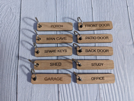 Engraved oak house key tags labelled Front Door and Back Door on metal split rings