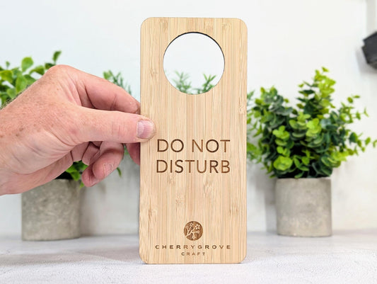 5mm bamboo door hanger engraved with Do Not Disturb text, potted plants background