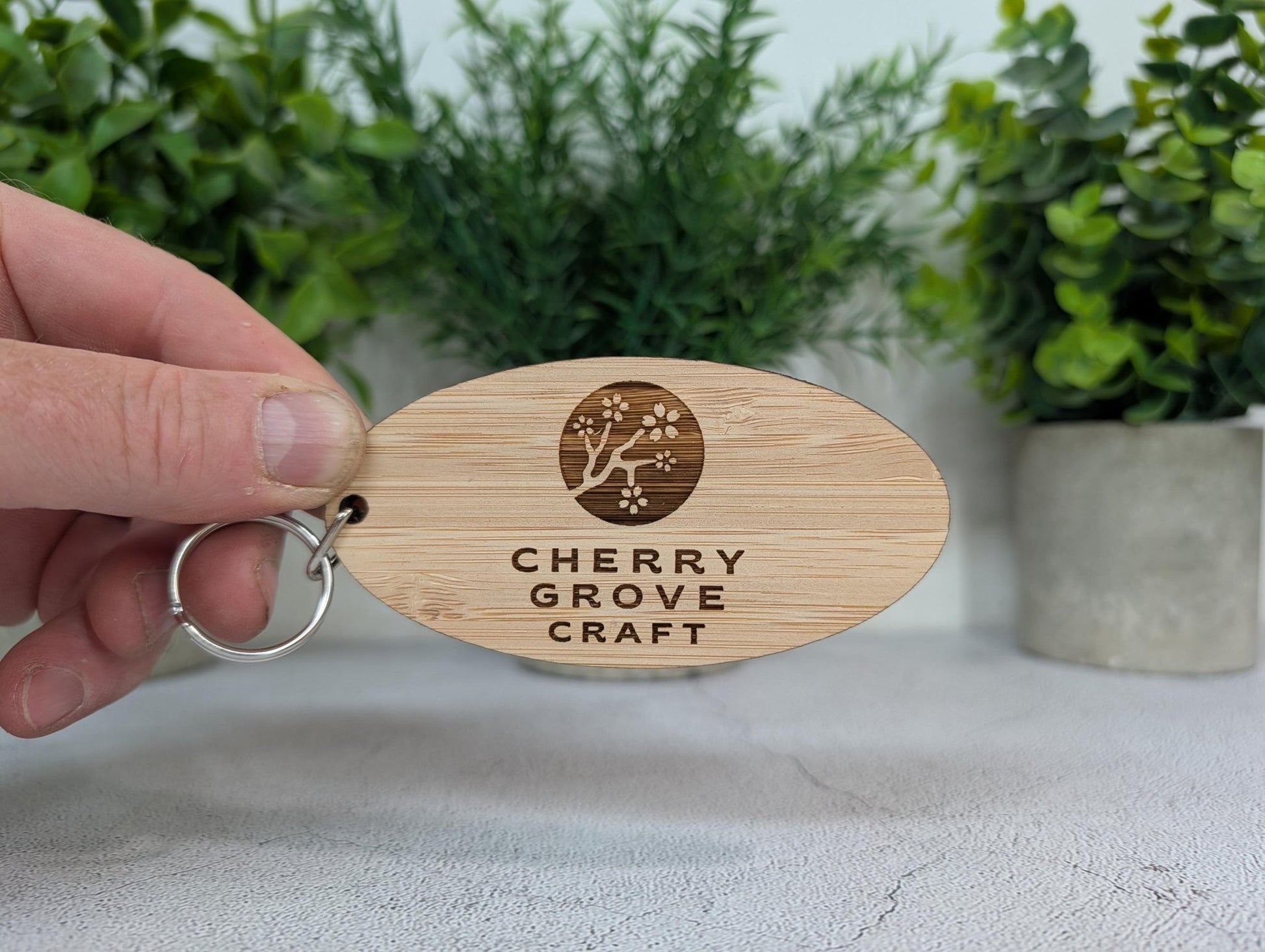 Edge view of 5mm FSC-certified Moso bamboo keyring showing the thicker premium profile