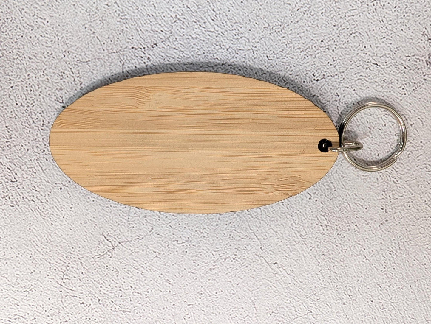 5mm bamboo oval keyring for business branding, engraved and finished in North Wales