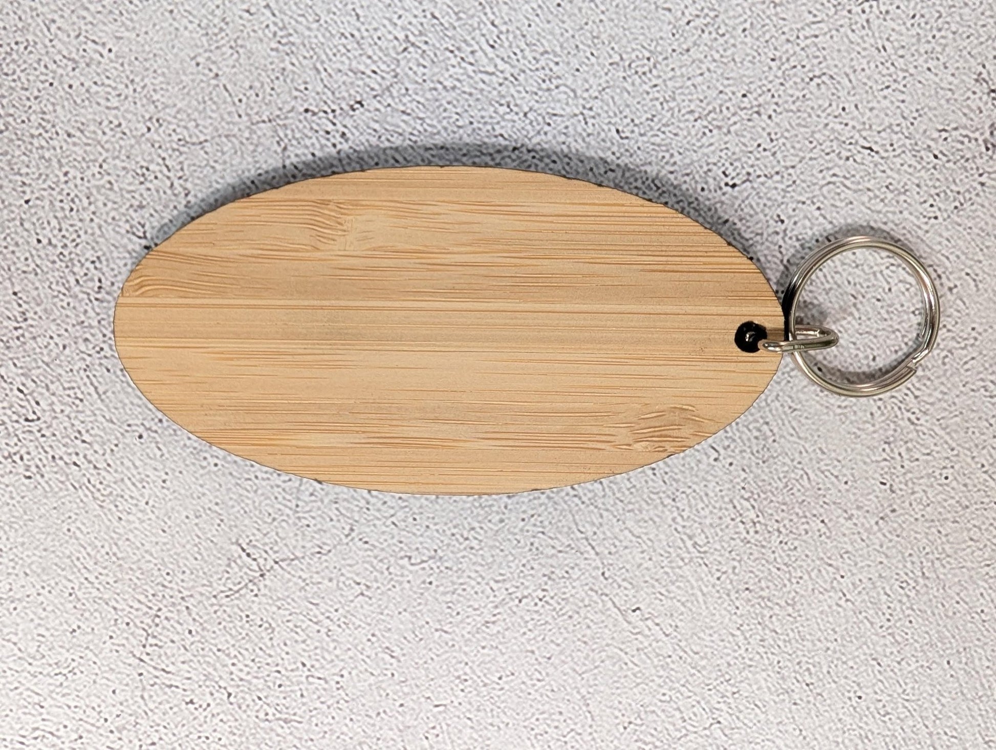 5mm bamboo oval keyring for business branding, engraved and finished in North Wales