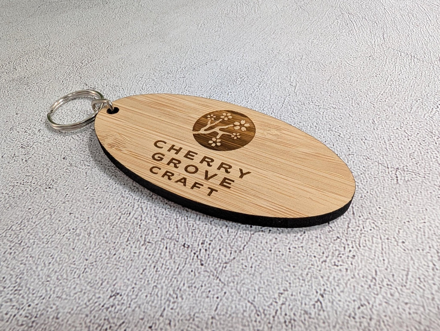 5mm bamboo oval keyring compared for size and thickness