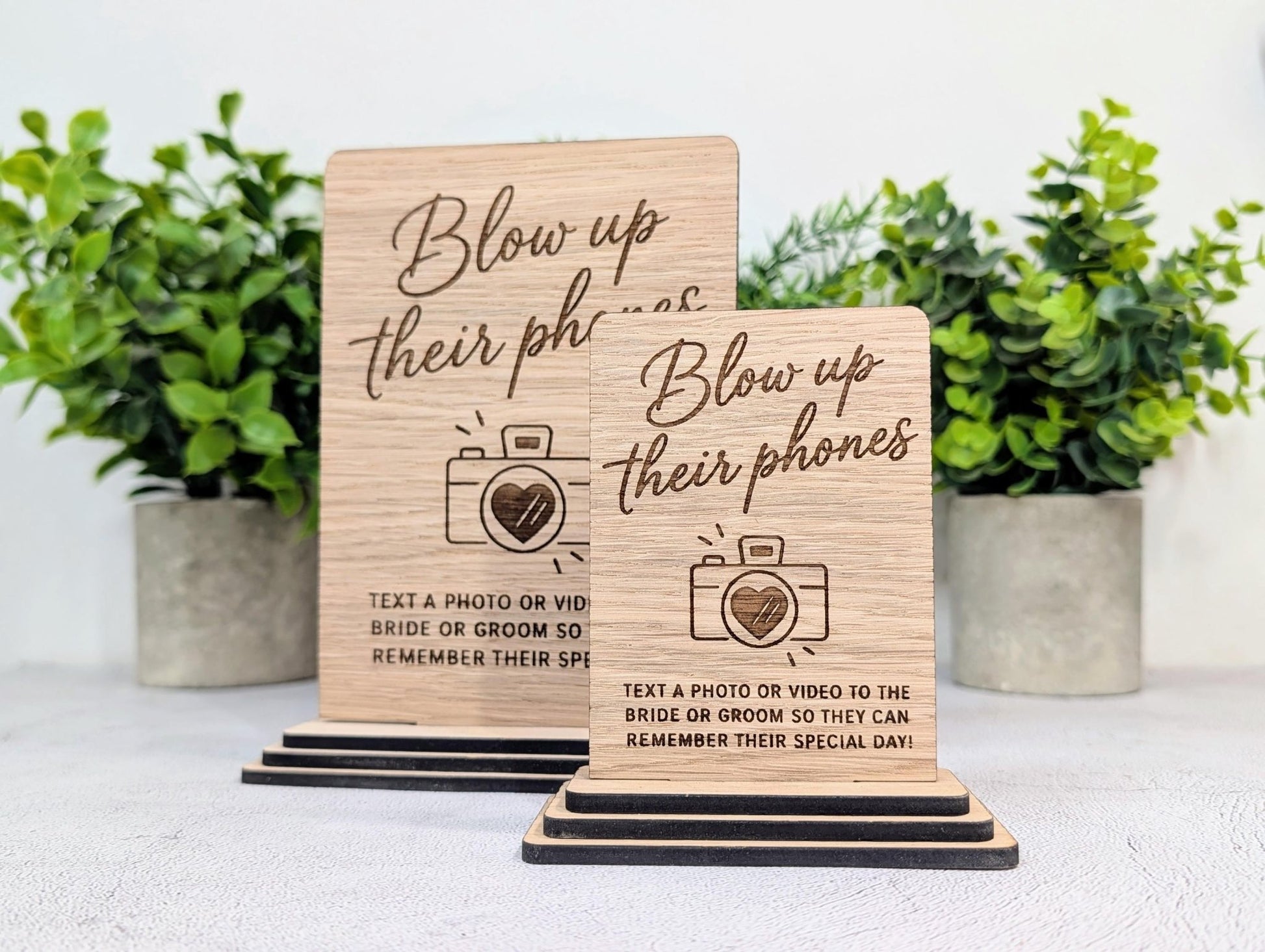 Laser-engraved script heading on the oak veneer wedding table sign