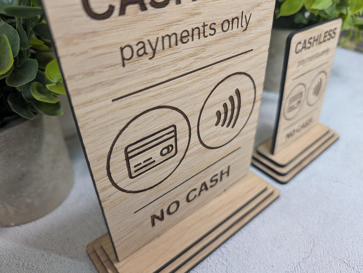 Cashless payments only sign — both sizes Standard and Large shown on white background