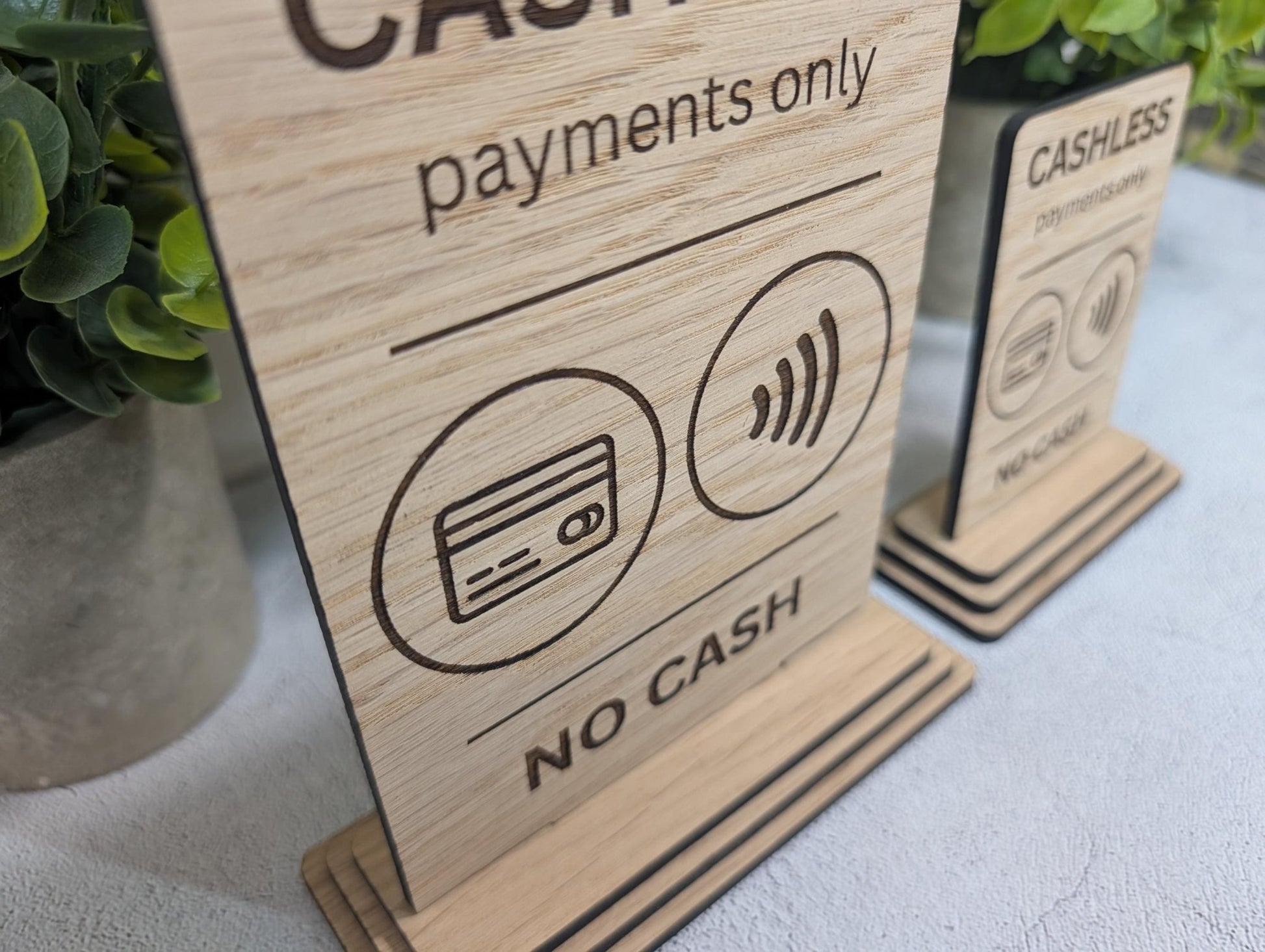 Cashless payments only sign — both sizes Standard and Large shown on white background