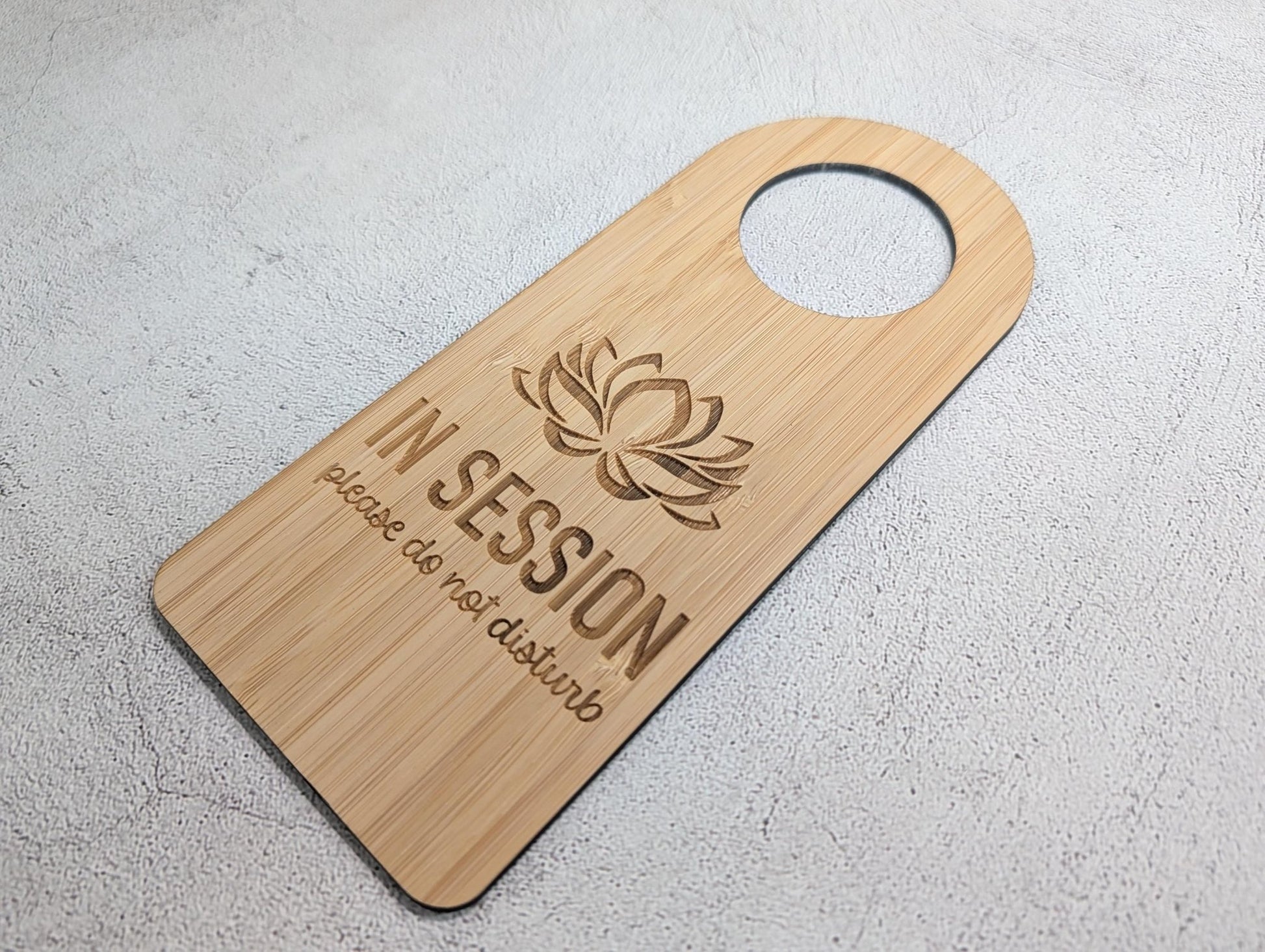 Close-up of the In Session bamboo door hanger for counselling and private practice rooms