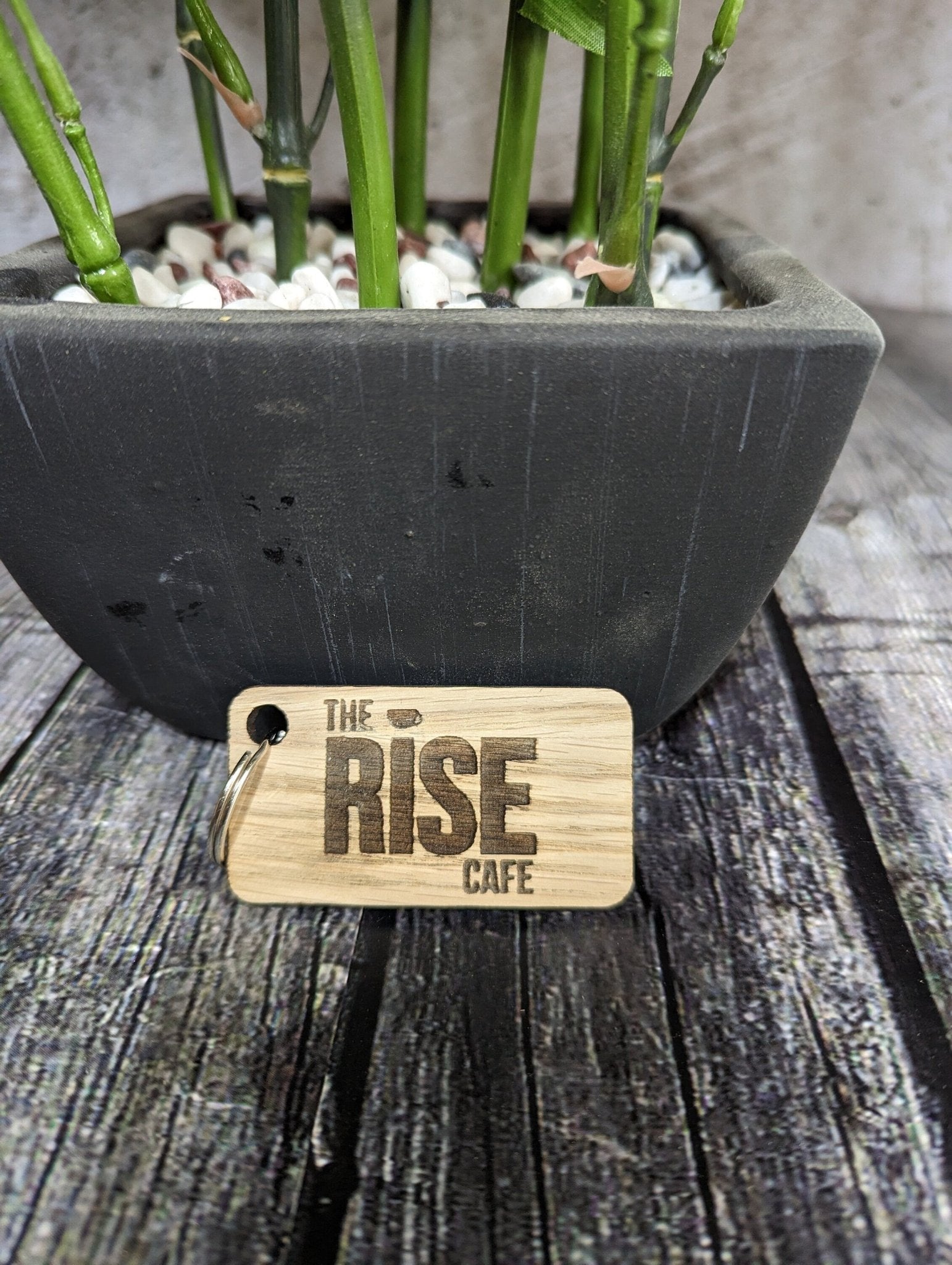 Double-sided oak keyring 65x35mm — logo one face, text the other