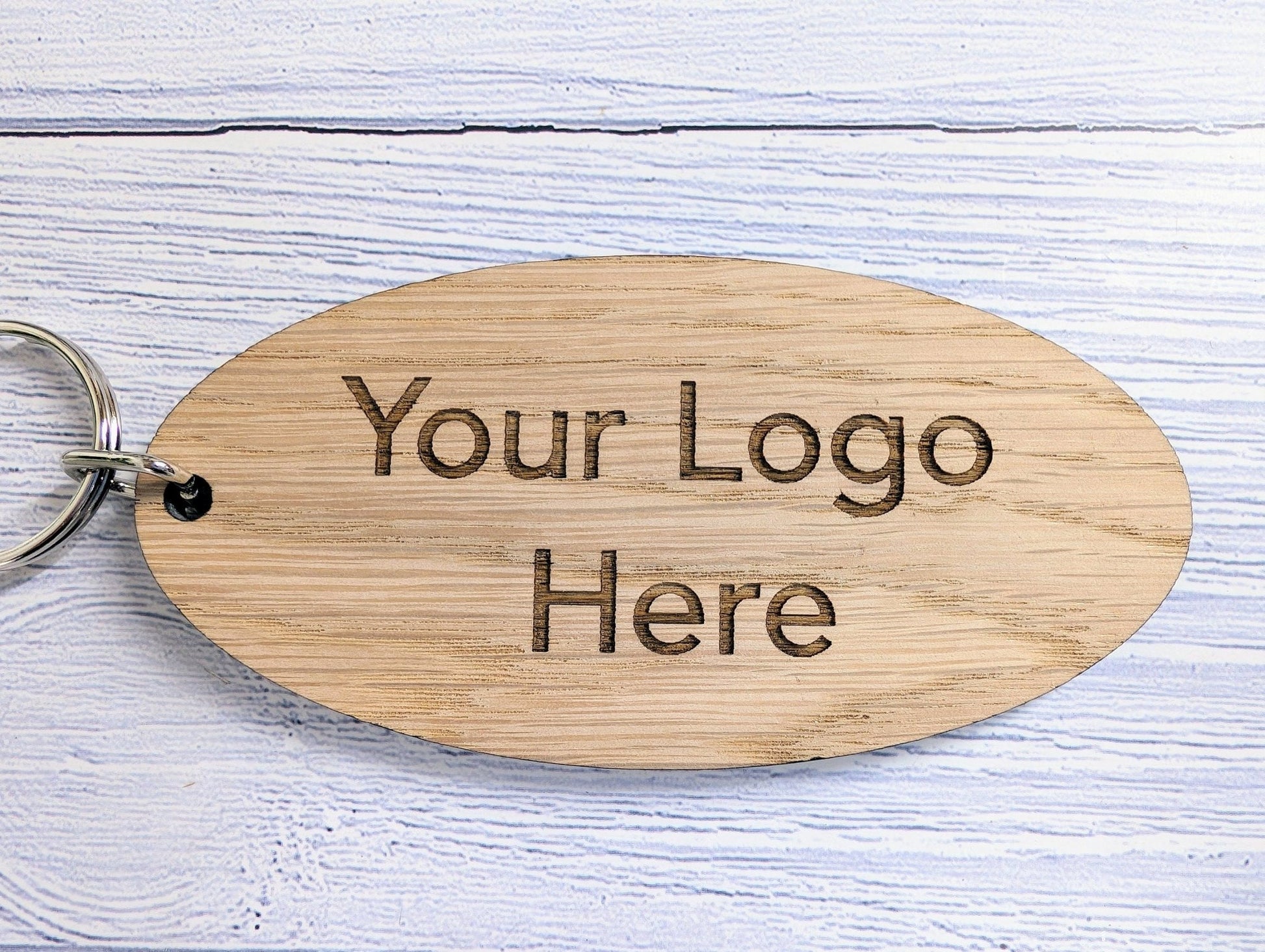 Custom logo large oval oak keyring 100x50mm — engraved with business logo