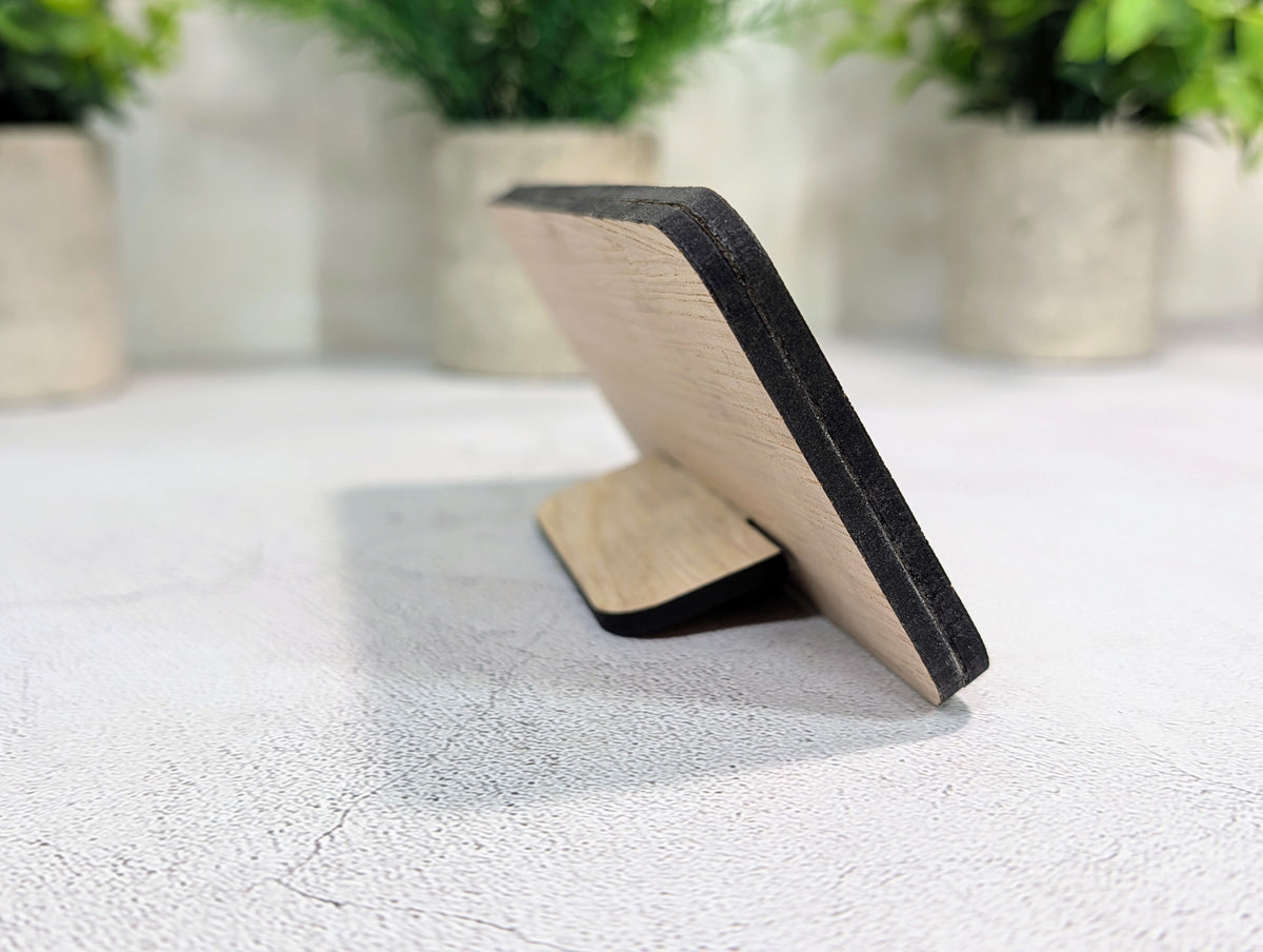 Back of the custom QR code stand at an angle, with the 4mm oak tab pushed into its slot
