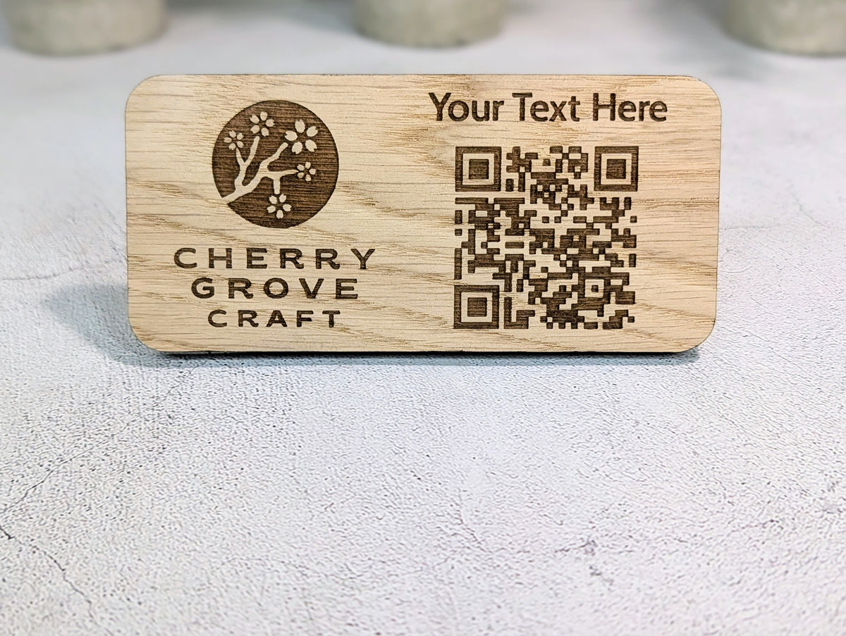 Close-up of the custom QR code stand on a table: logo on the left, "Your Text Here" above the QR code on the right
