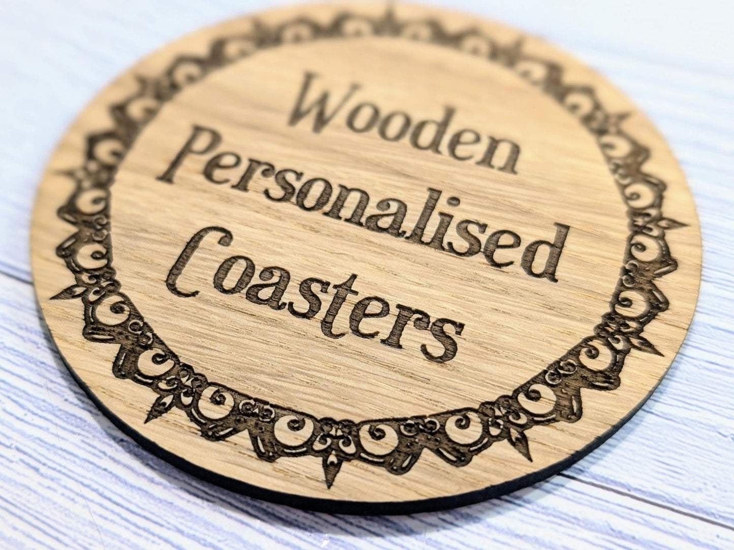 Engraved border coaster side view — 4mm thickness, Danish oiled