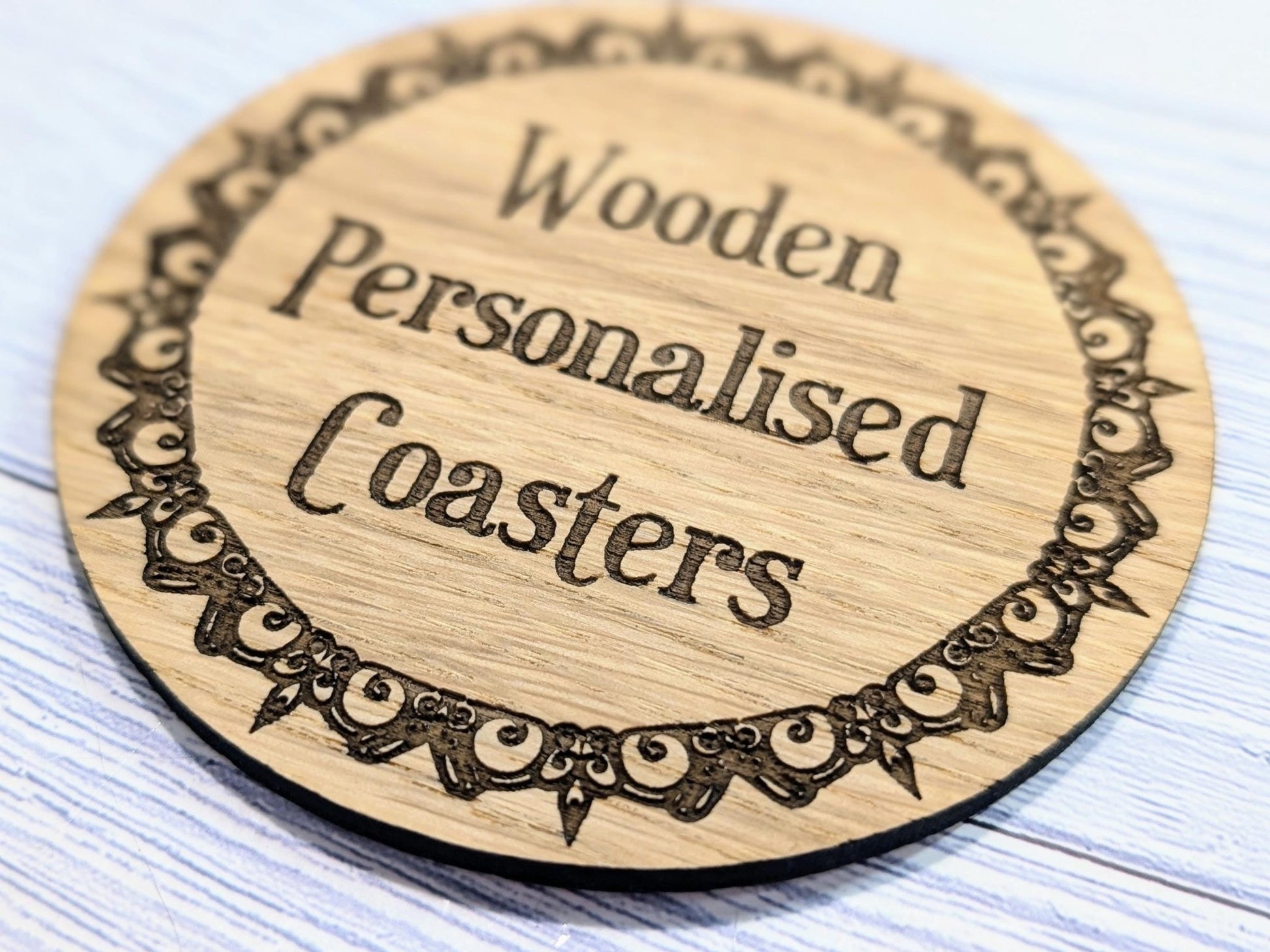 Engraved border coaster side view — 4mm thickness, Danish oiled