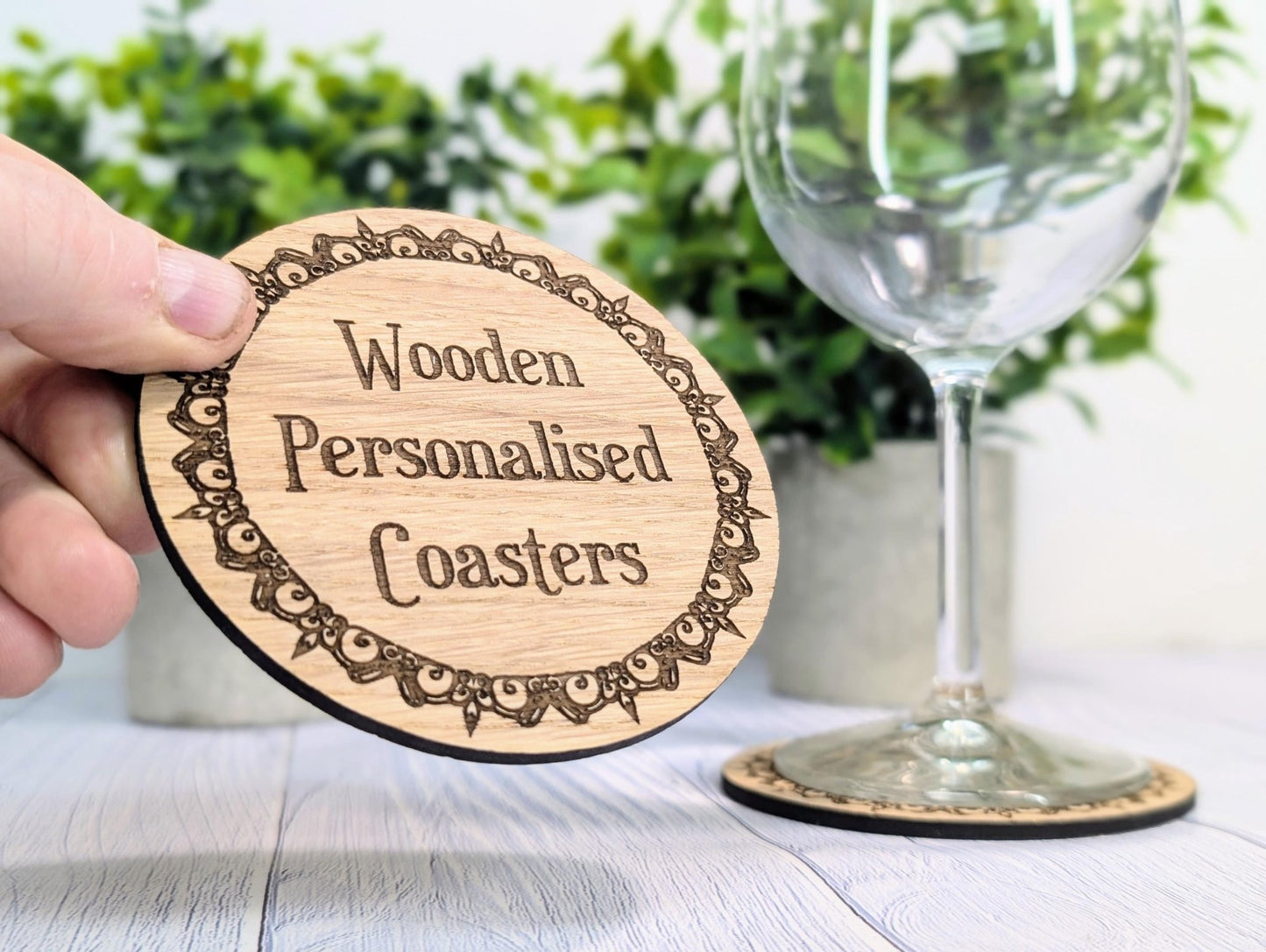 Engraved border oak coaster close-up — Danish oil finish, 100mm