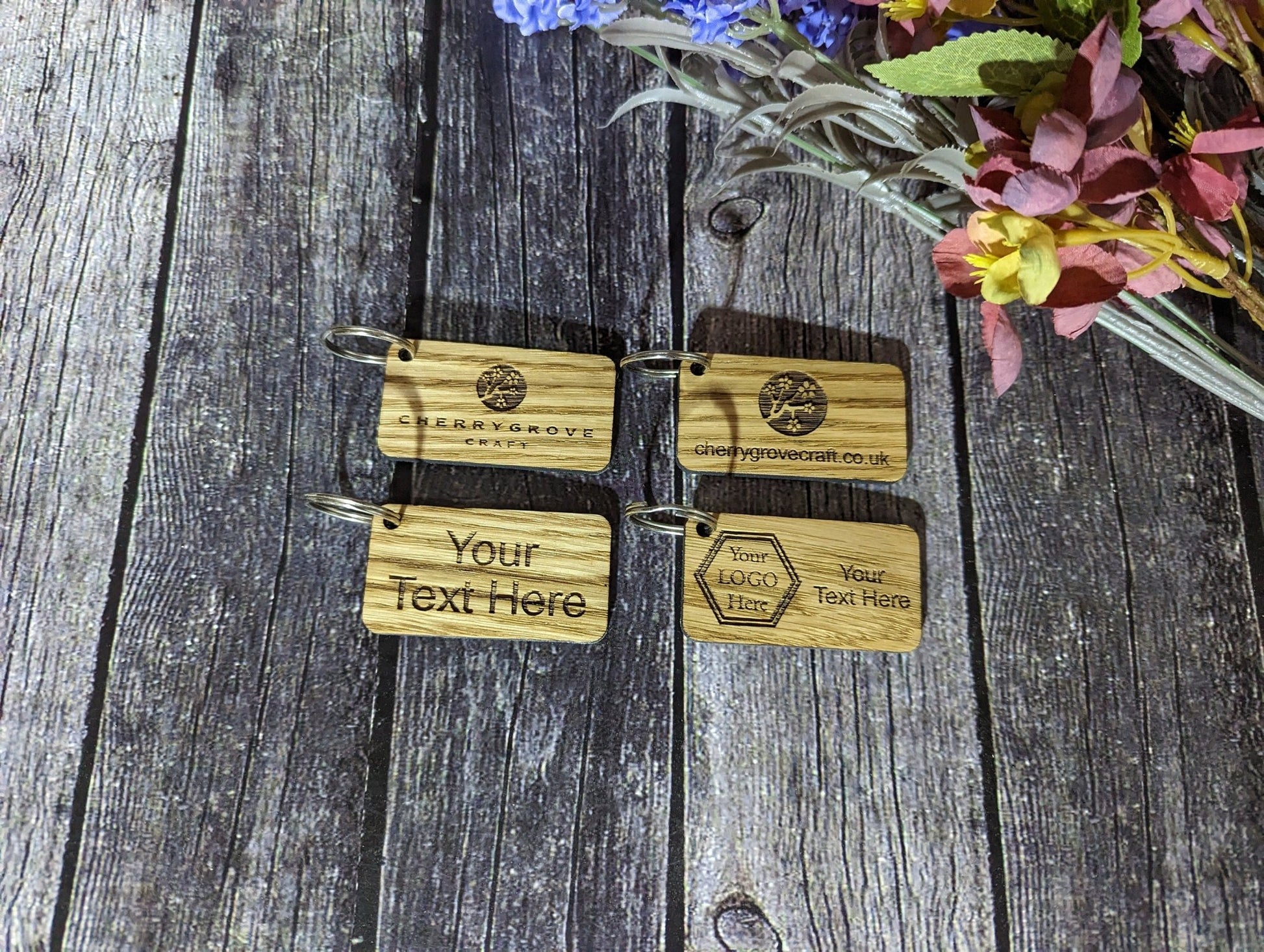 Branded keyring reverse — smooth oak veneer, split ring, made in North Wales