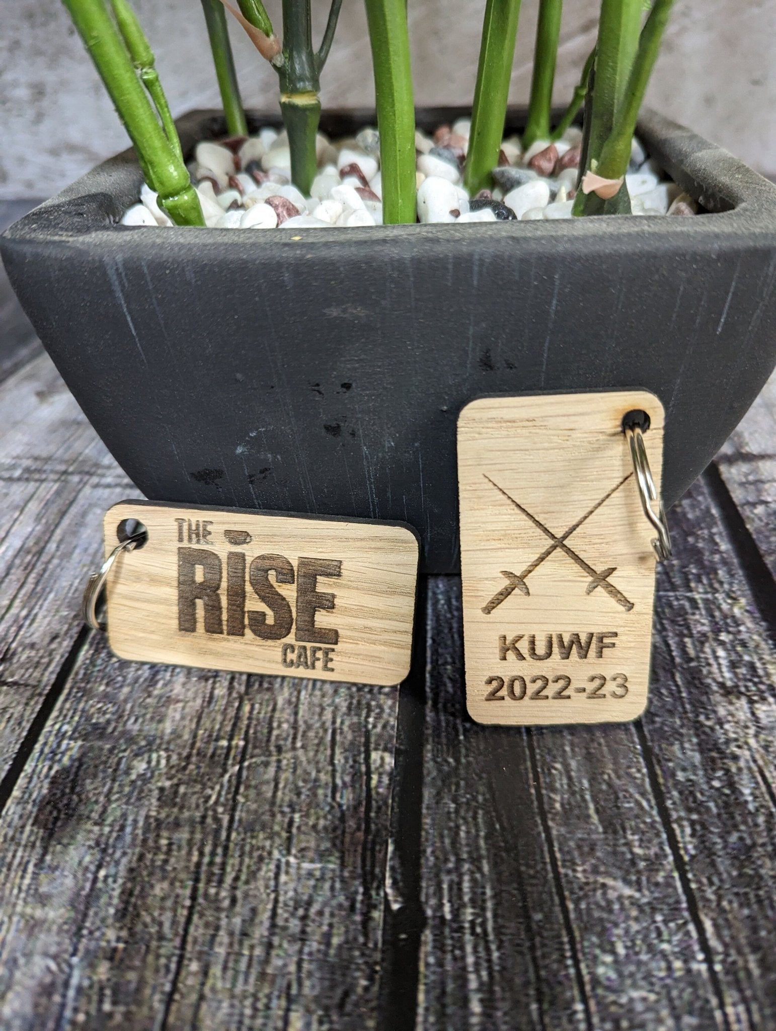 Custom branded oak keyring in Danish oil finish — deeper grain, premium look