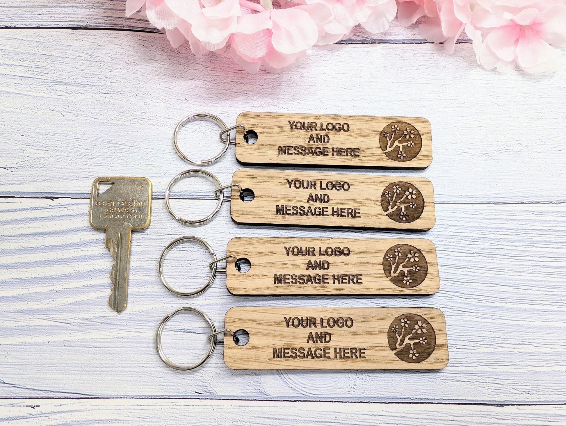 Double-sided 90x25mm oak keyrings — made in North Wales, bulk orders