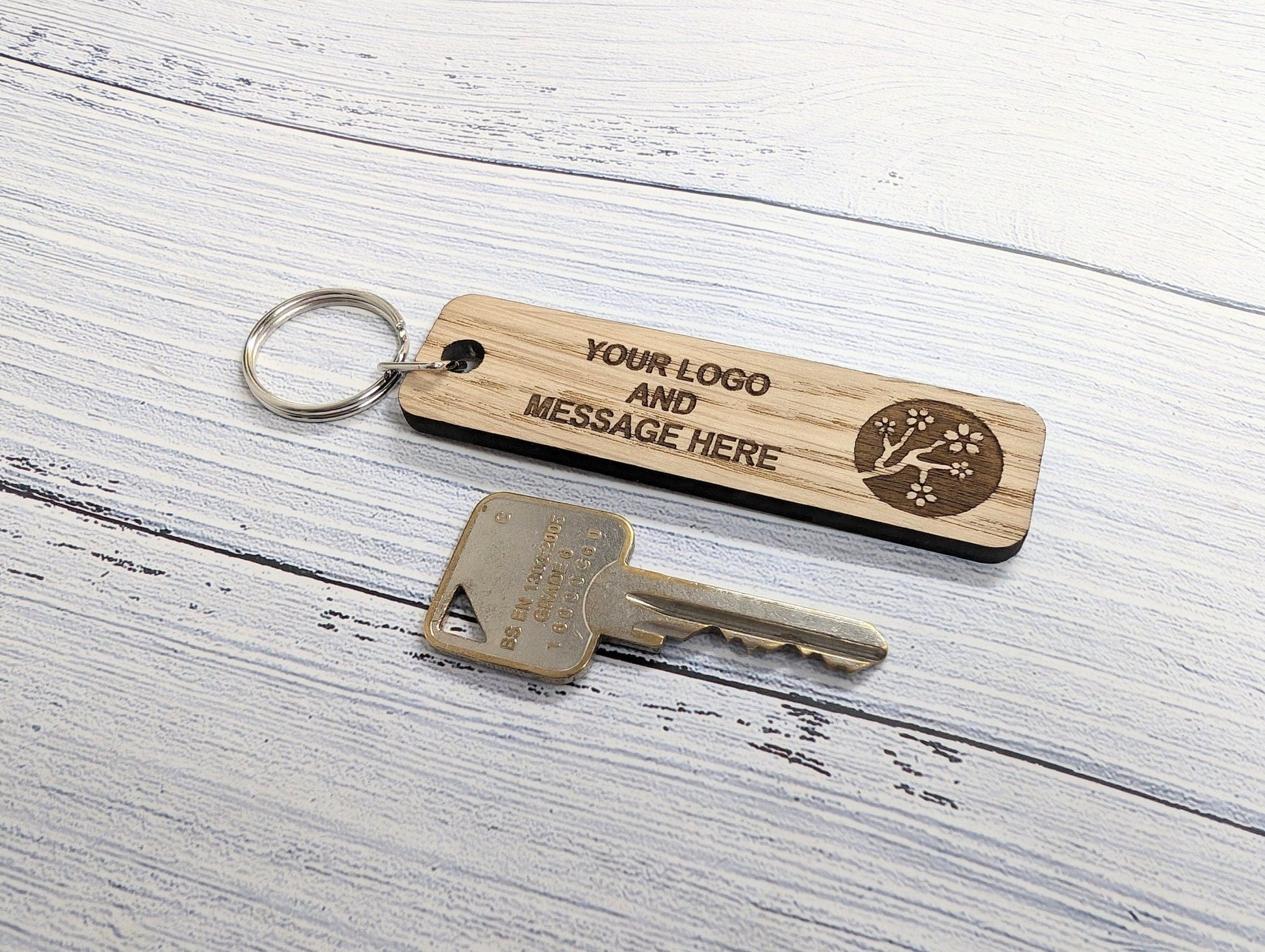 Double-sided oak keyring showing reverse face — text or room number