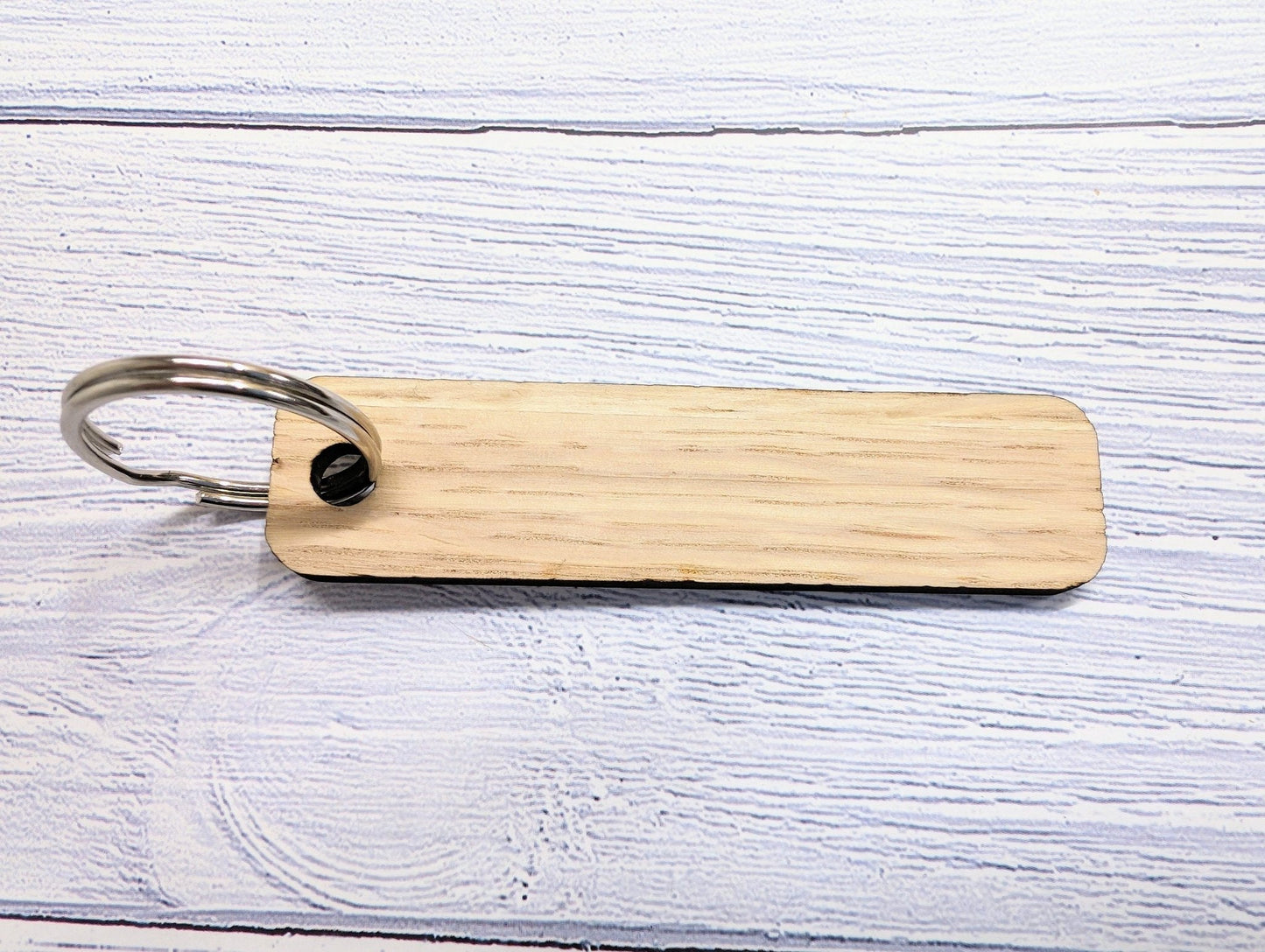 Custom logo oak keyrings in bulk — corporate hospitality set, made in North Wales