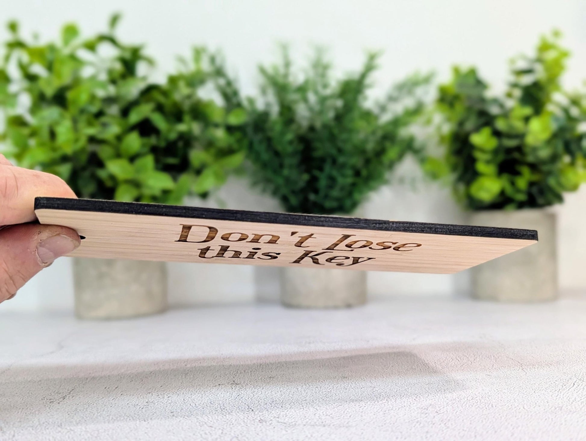 Extra-large 200x80mm bamboo key fob, deliberately oversized so it is hard to misplace