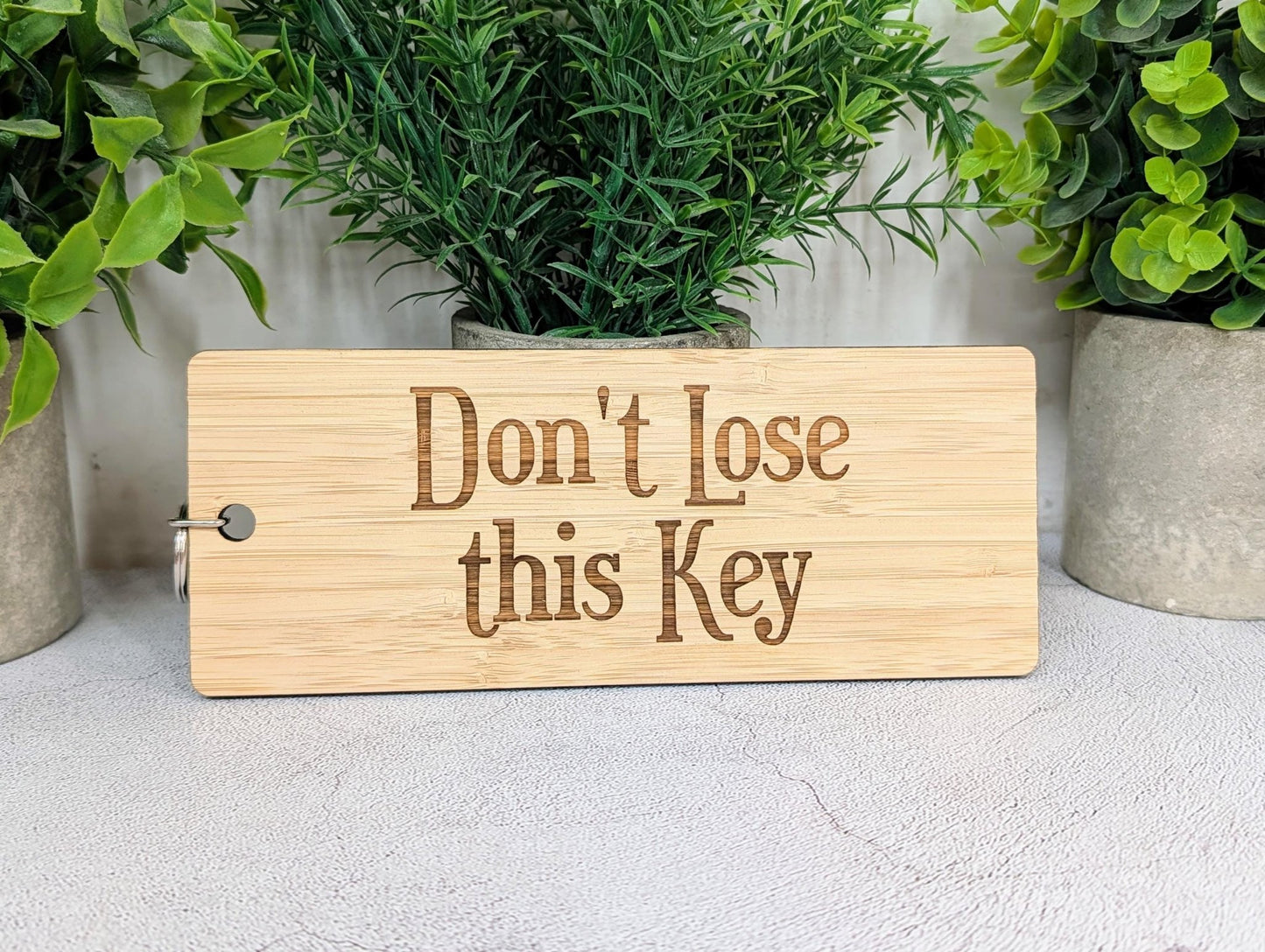 Don't Lose This Key bamboo keyring personalised with a custom engraved logo