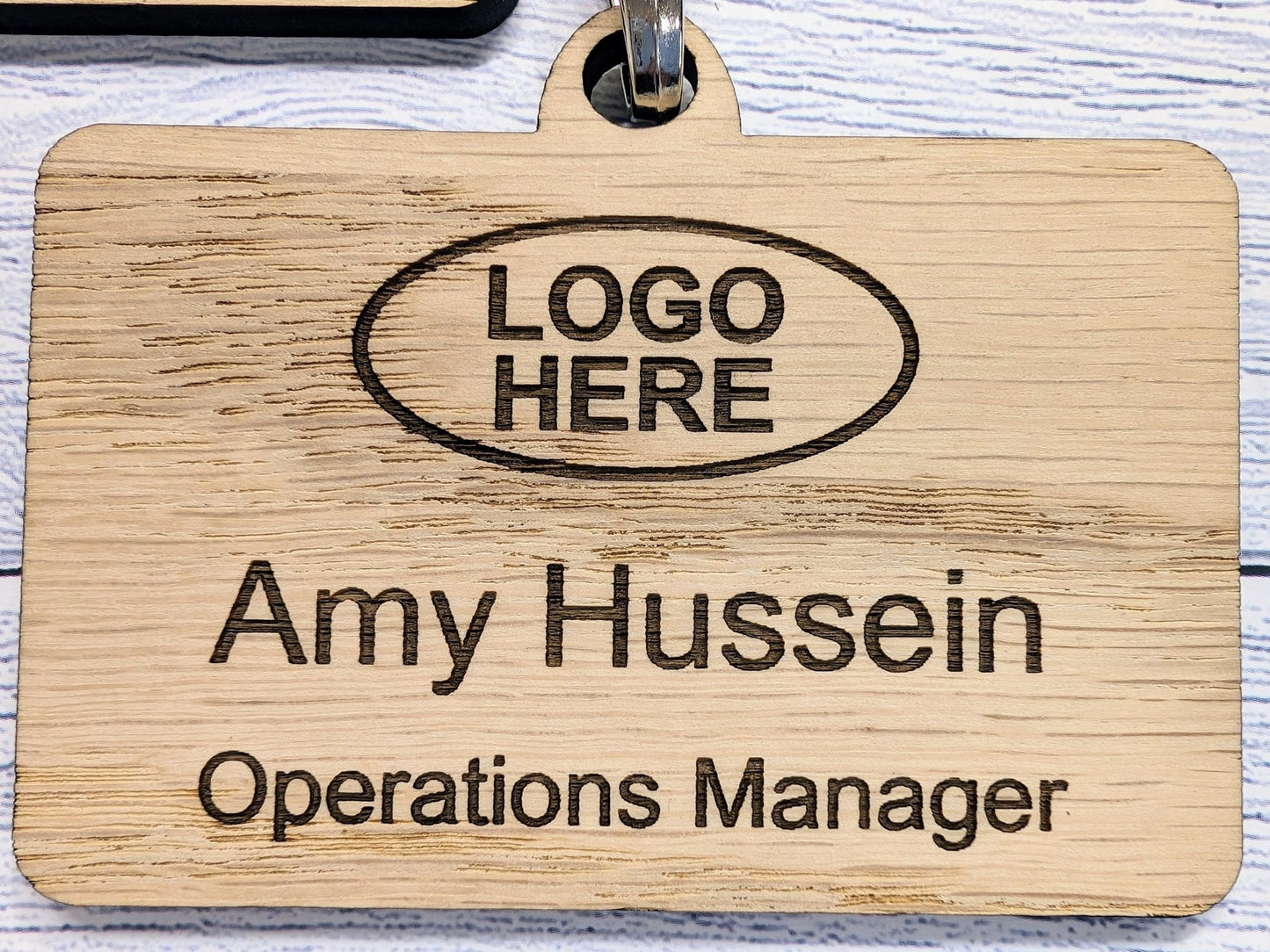 Custom wooden name badges with lanyards — made to order in North Wales