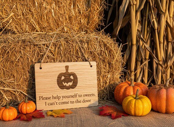 Halloween pumpkin oak sign close-up showing engraved detail