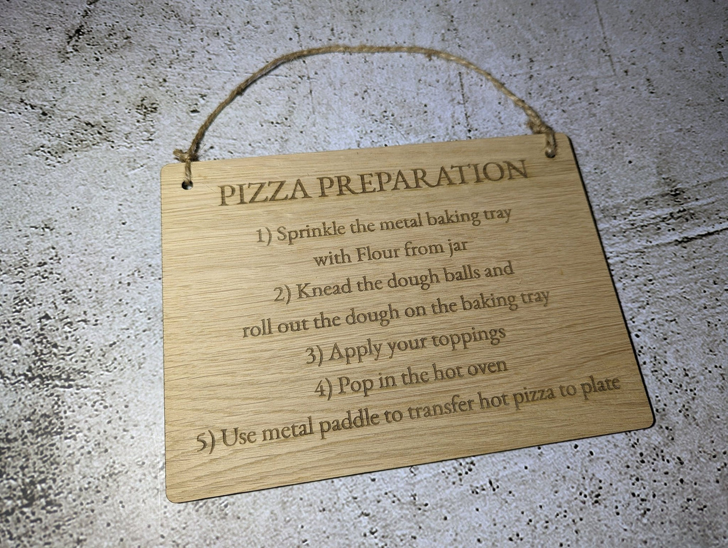 Personalised oak sign close-up of engraved text — medium size with jute string