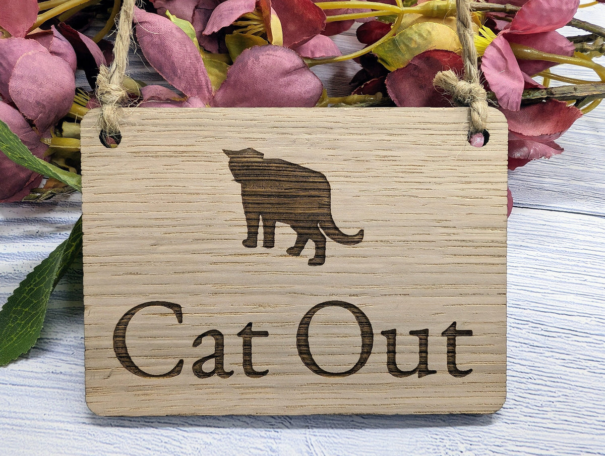 Double-sided Cat In / Cat Out hanging sign in oak veneer with jute string