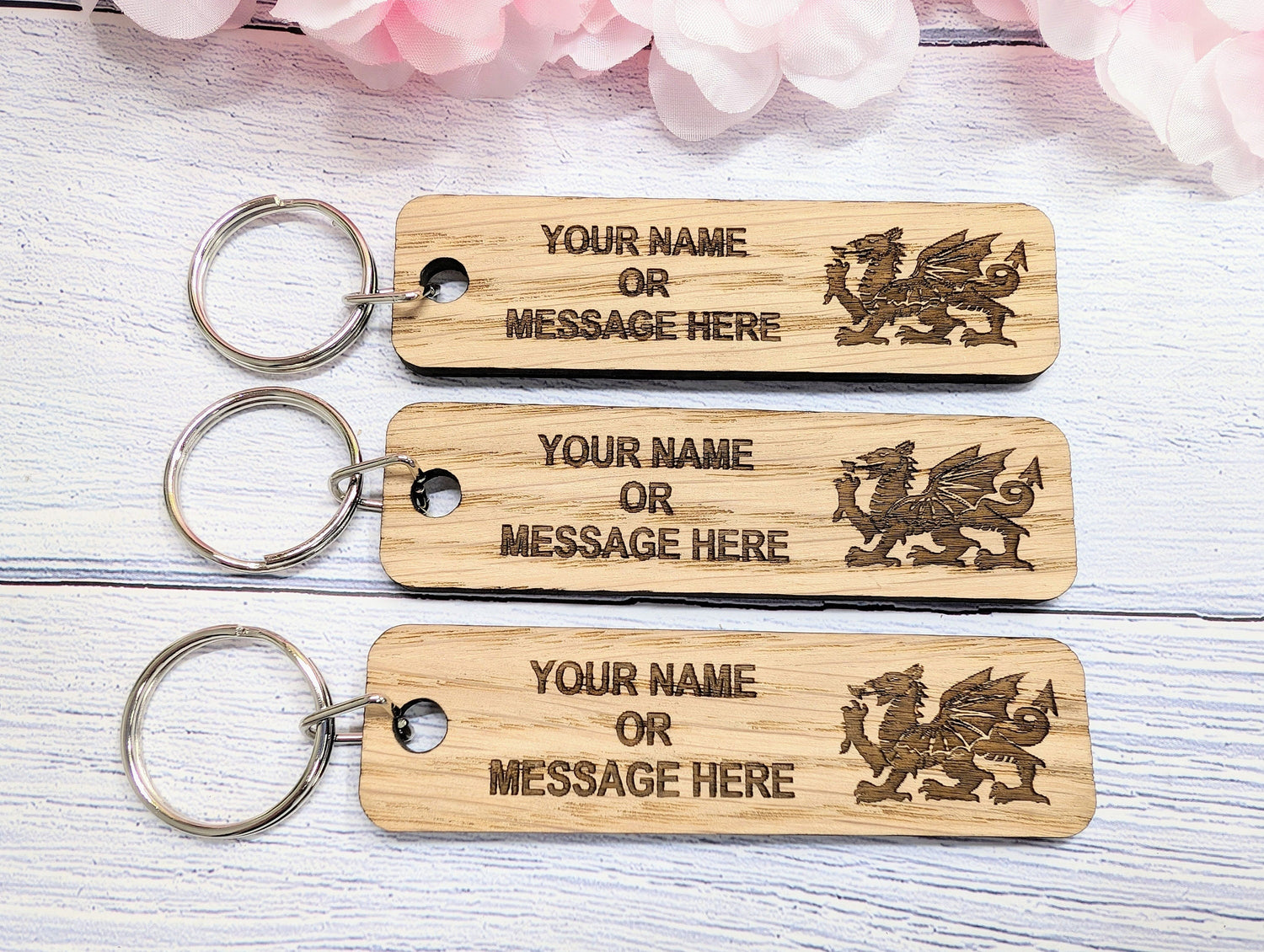 Personalised Welsh Dragon oak keyring 90x25mm — custom text for hotels, clubs and gifts