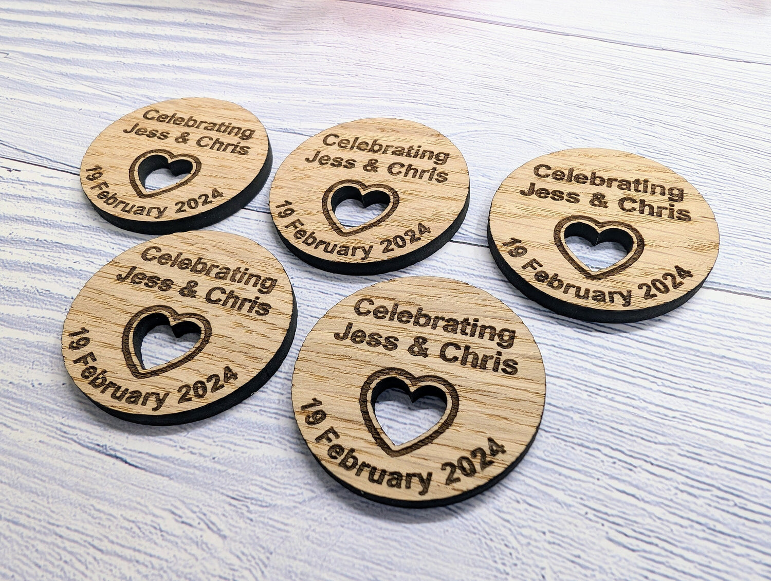 Personalised wooden wedding favour discs — oak veneer, names and date, table favours