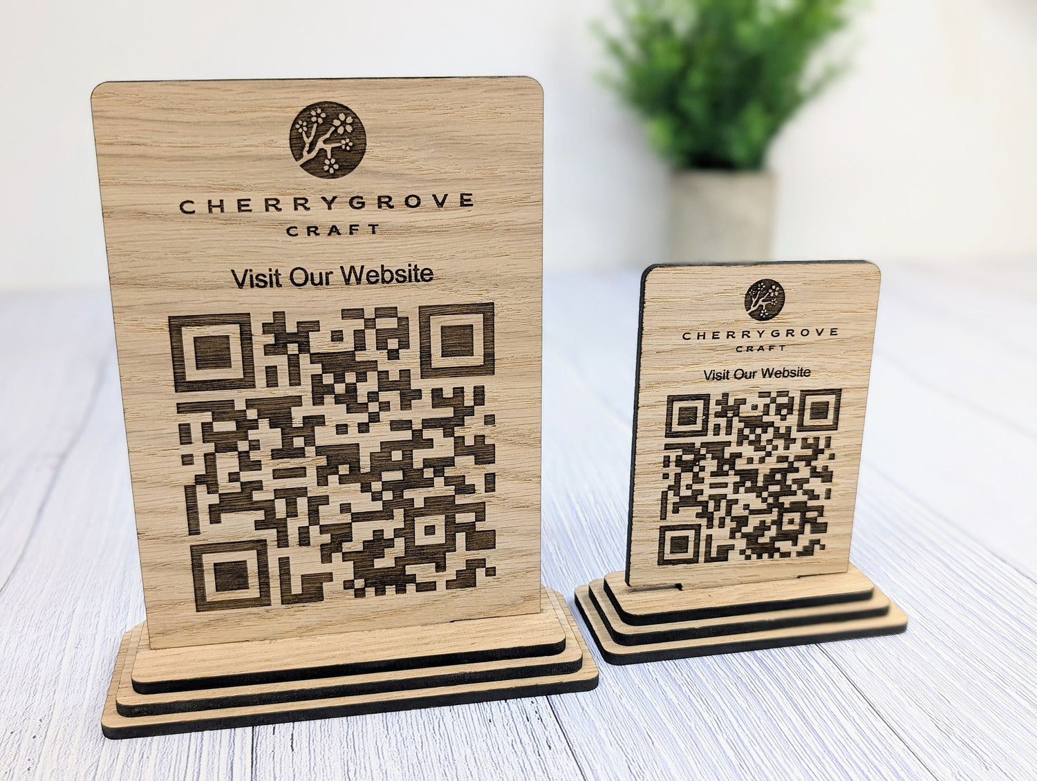 Wooden QR code sign with logo — standard and large sizes, freestanding on flat surface