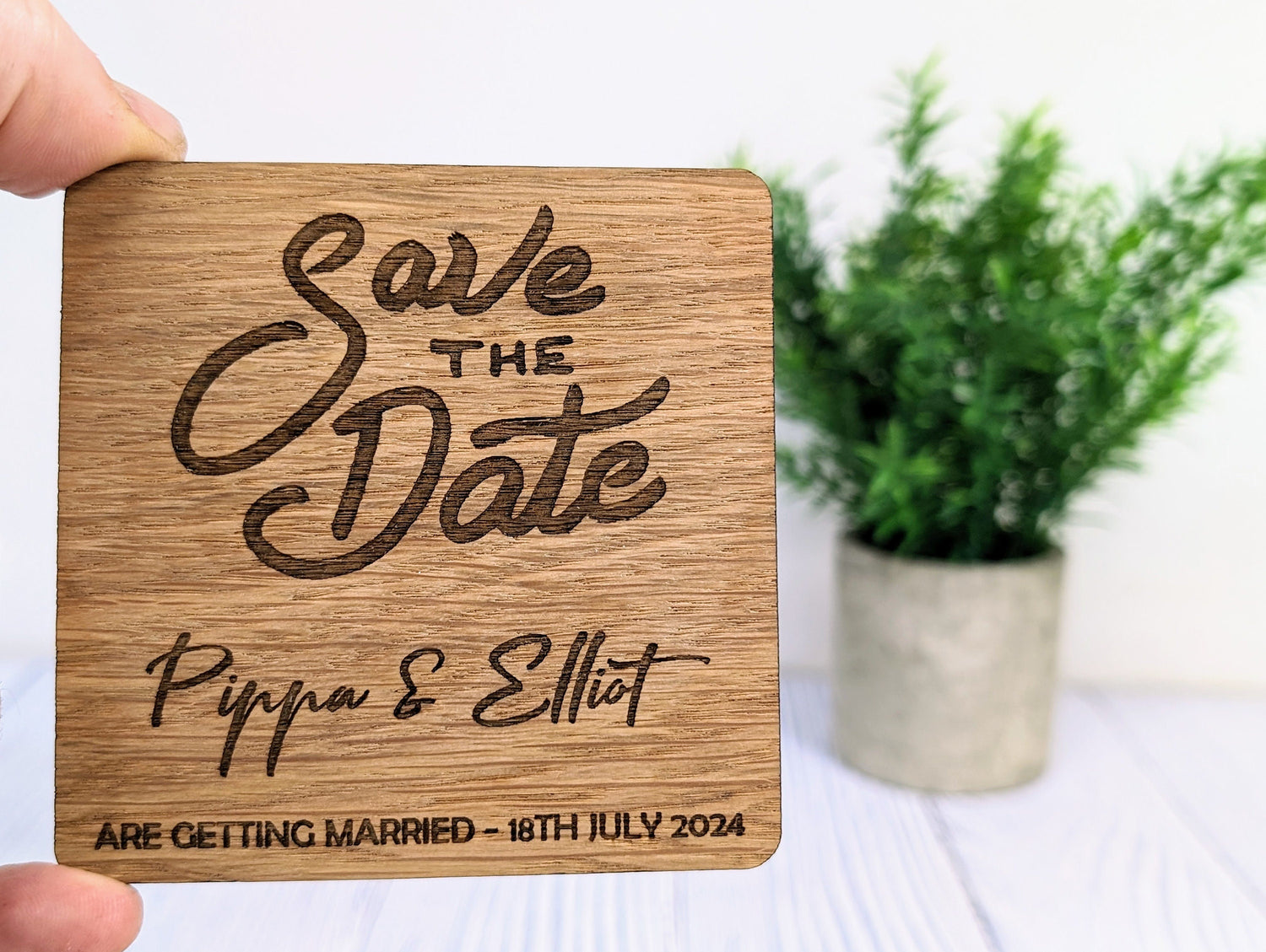 Personalised oak save the date coaster with bold stacked script design, 90mm, laser engraved