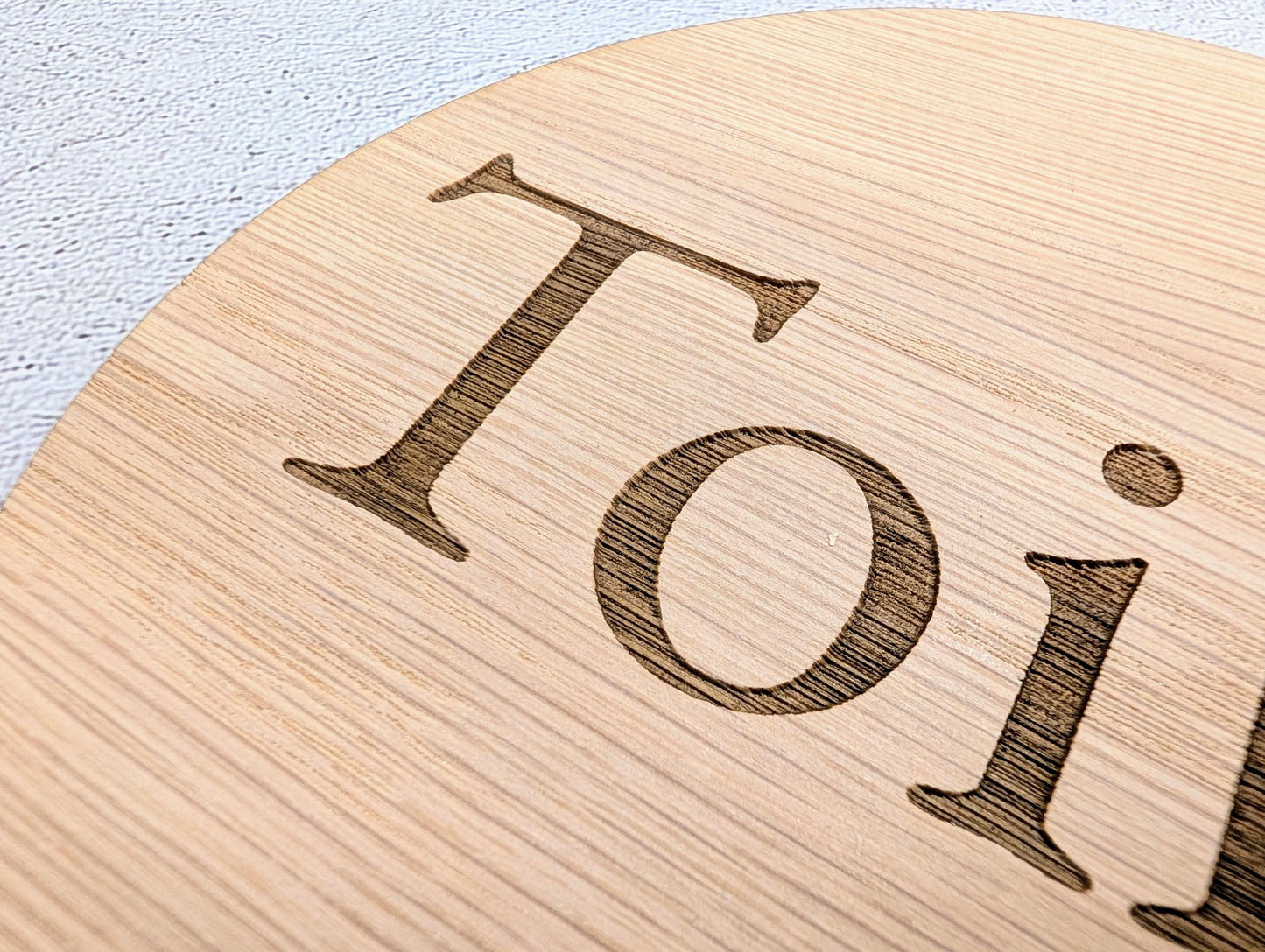 Toilet Door Sign – Circular Oak Veneered Wooden Bathroom Sign, Indoor Use Only, Handmade in Wales, Plastic-Free Packaging, 2 Sizes