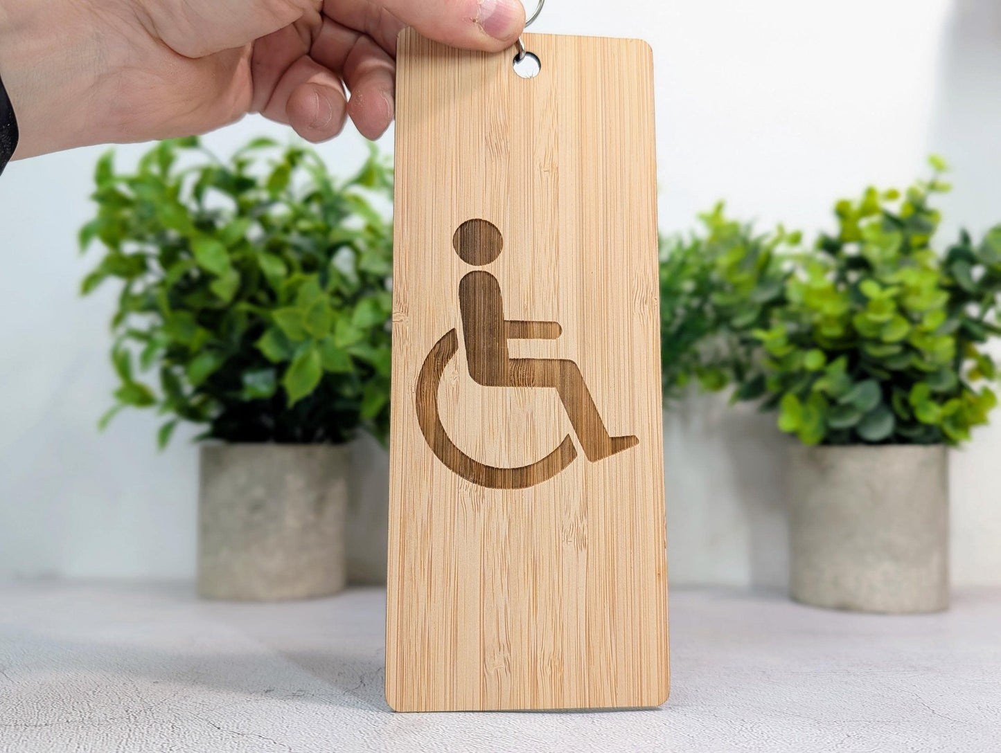 Accessible Bathroom Bamboo Keyring — wheelchair symbol engraved on XL bamboo keyring, 200x80mm