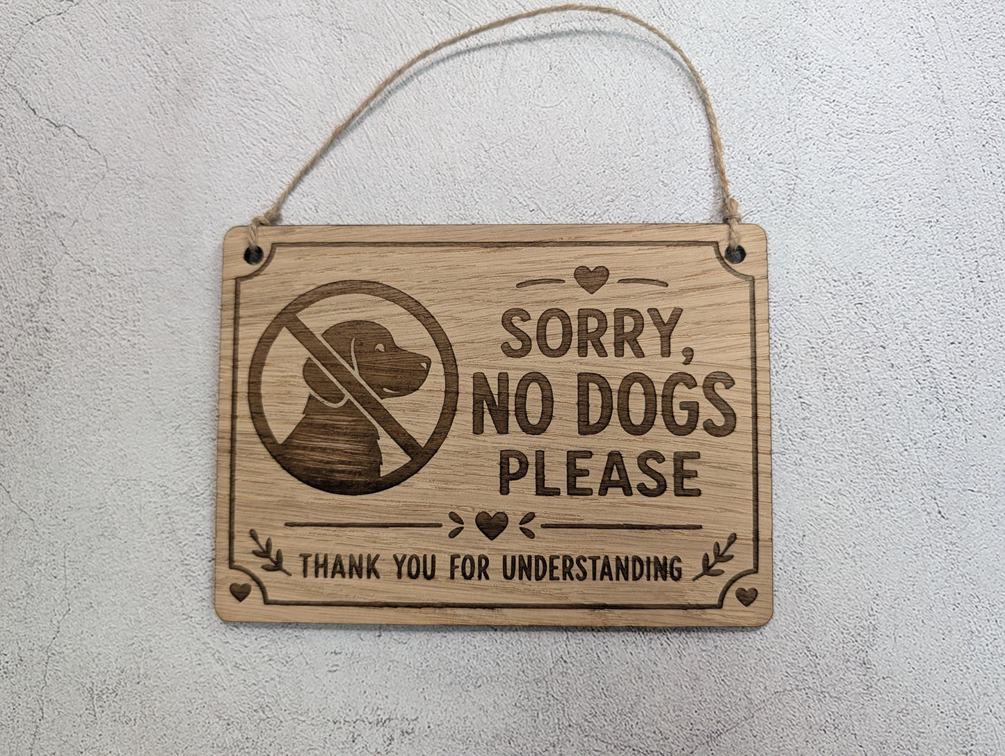 Sorry No Dogs Please sign shown in four sizes, oak veneer