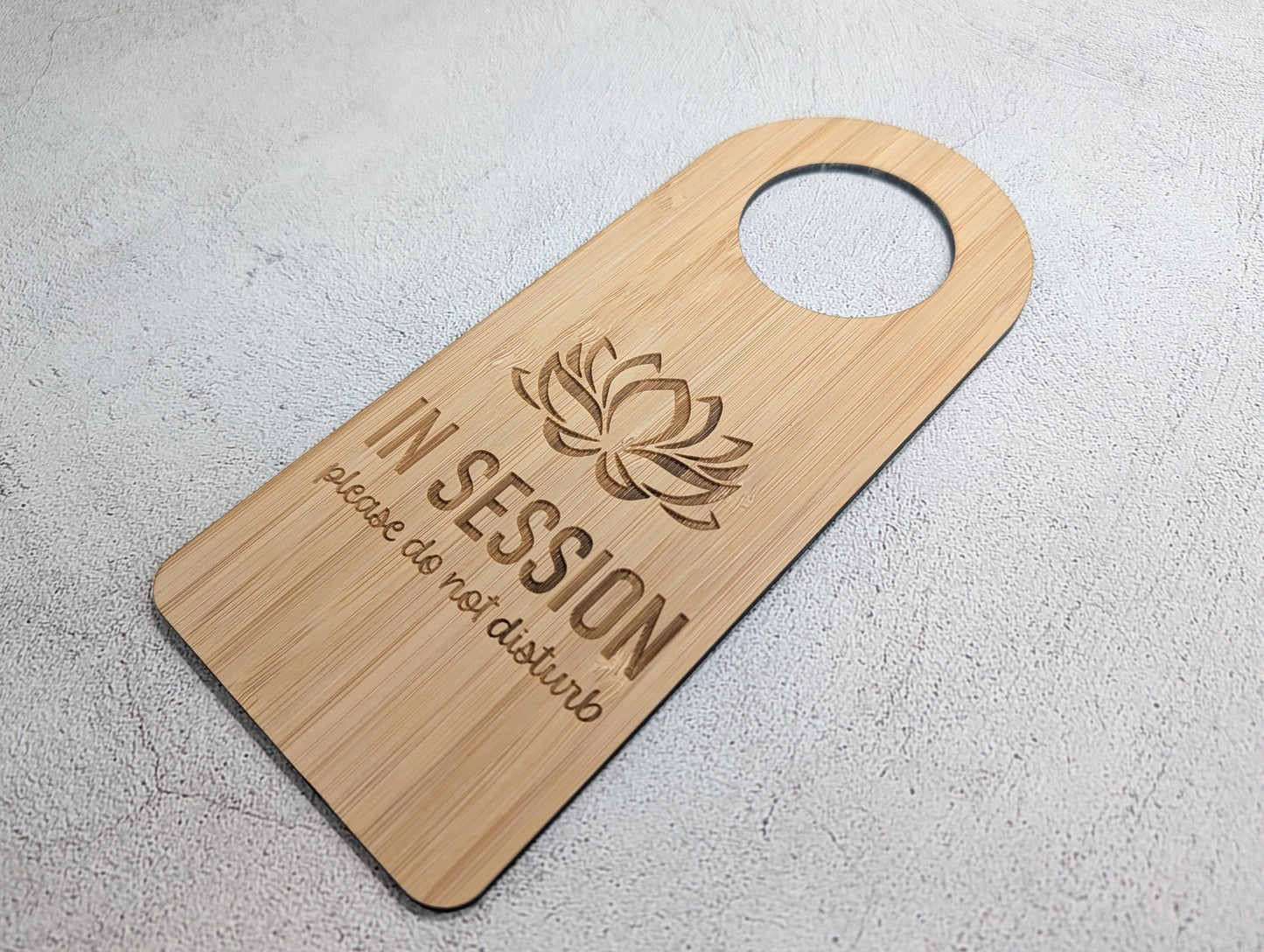 Close-up of the In Session bamboo door hanger for counselling and private practice rooms